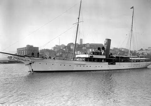 A white steam yacht at anchor in Cannes harbour, 1929